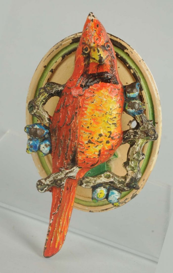 Cast Iron Cardinal Doorknocker.: Hubley. Brightly painted cardinal perched on branch with berries. Condition (Excellent). Size 5 - 1/4" T.