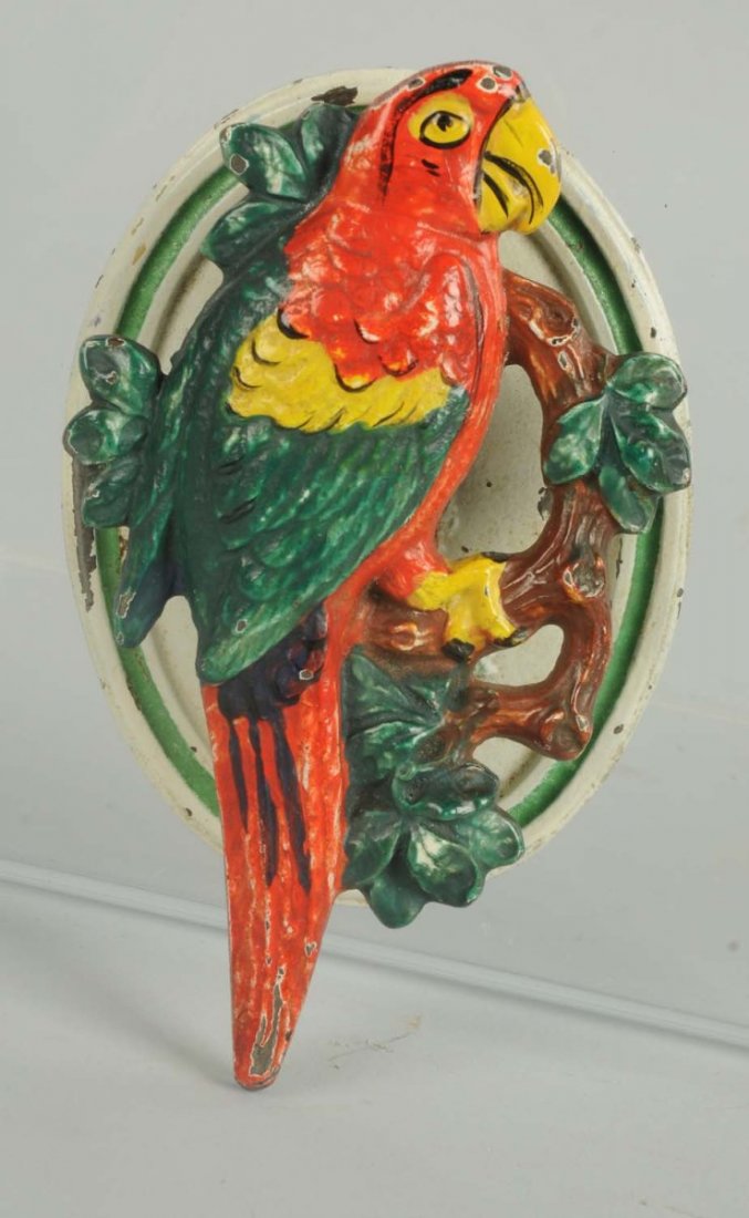 Cast Iron Parrot on Branch Doorknocker.: Hubley. Realistically painted parrot on branch looking straight forward. Striking colors. Condition (Excellent). Size 4 - 5/8" T.