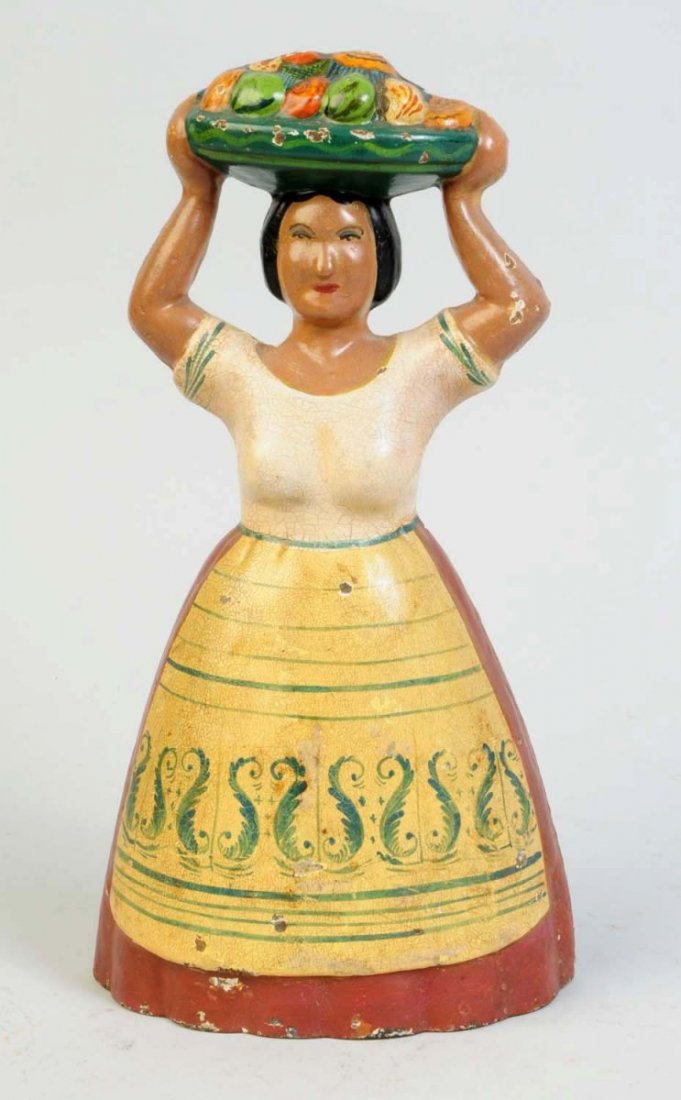 Cast Iron Tropical Woman with Fruit Doorstop.: Signed "1000" on back of base. Condition (Excellent).
