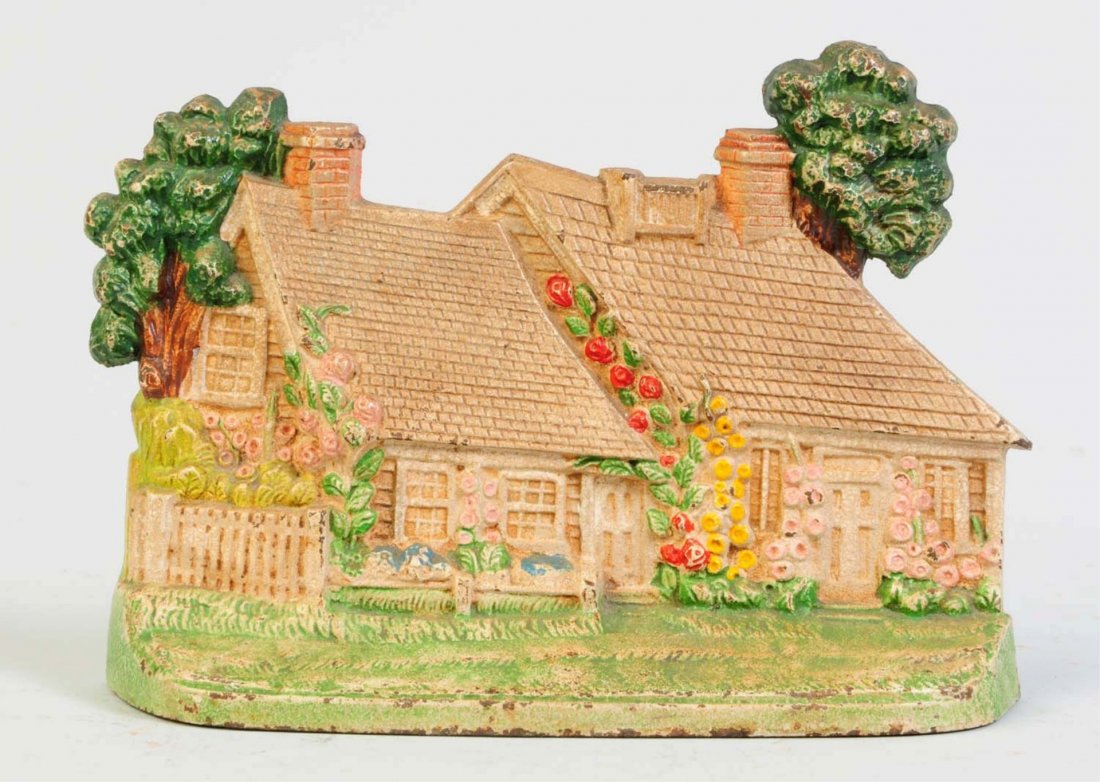 Cast Iron Cape Cod Cottage Dootstop.: Made by Hubley. Condition (Very Good). Size 8 1/8" L.