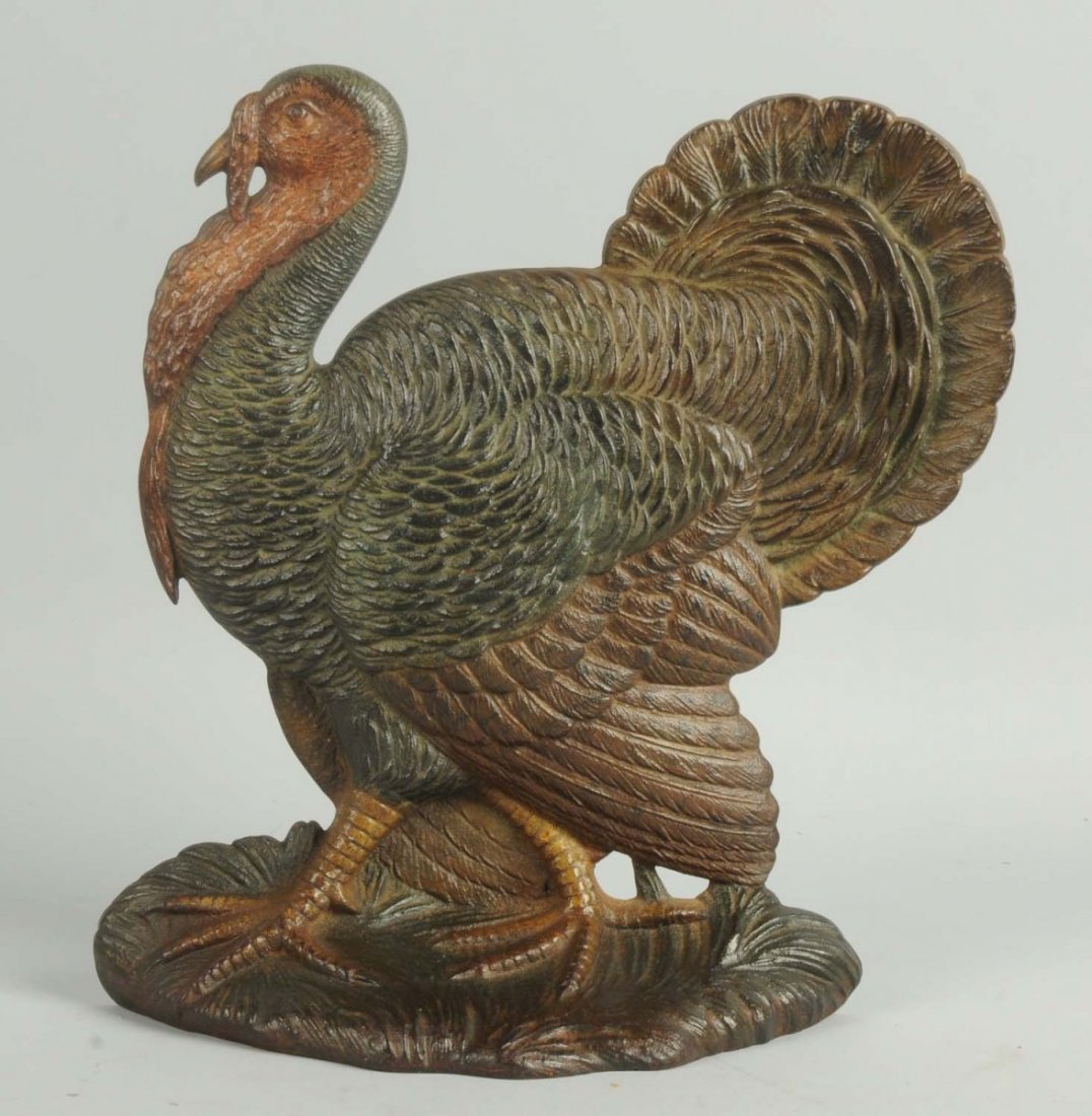Cast Iron Turkey Doorstop.: Bradley and Hubbard, rubber bumpers intact. Turkey with incredible imposing detail to casting done in realistic colors. Fantastic feathers with dropped wings and opened tail feathers. Rare and Desirab
