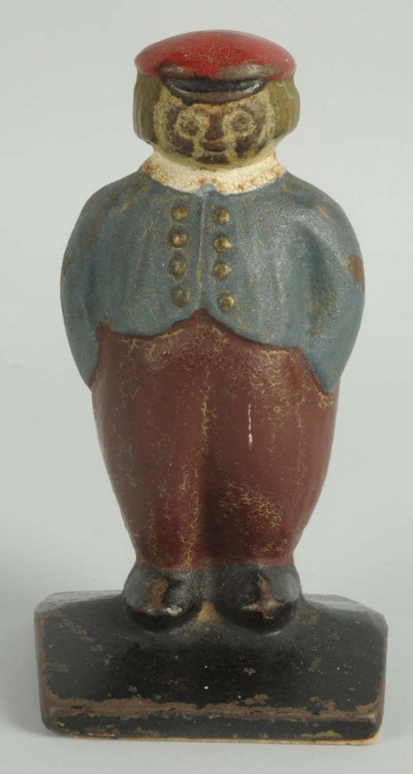 Cast Iron Dutch Boy Doorstop.: Showing Dutch Boy with hands in pockets standing on wedge base. Full-figure, solid casting. Rare. Condition (Excellent). Size 6" T.