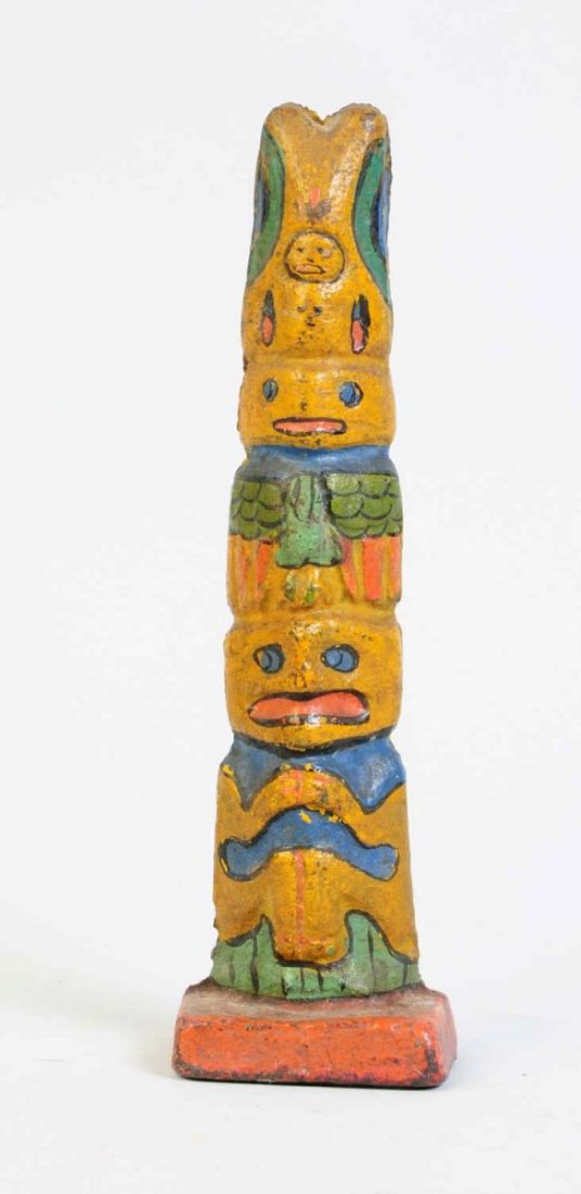 Cast Iron Totem Pole Doorstop.: Nice detail to casting with multi-colors. Condition (Excellent). Size 8 1/2" T.
