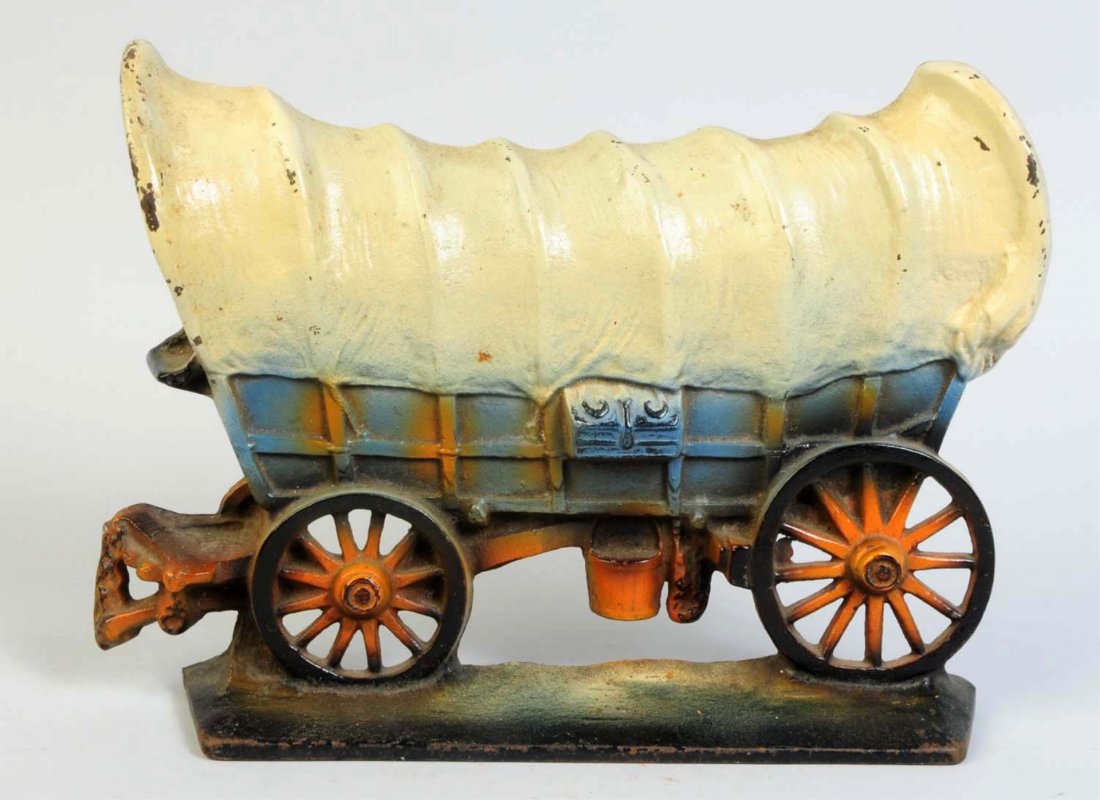 Cast Iron Conestoga Covered Wagon Doorstop.: This is a variation Conestoga Wagon with tongue. Signed, "Copyright 1930, Creations Company." Condition (Excellent Plus). Size 11 1/4" L.