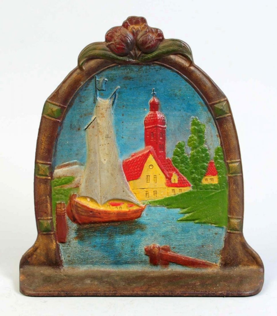 Cast Iron Sailing Ship Doorstop.: Sailing ship docked with church and cottage in background. Condition (Excellent). Size 11 5/8" T.