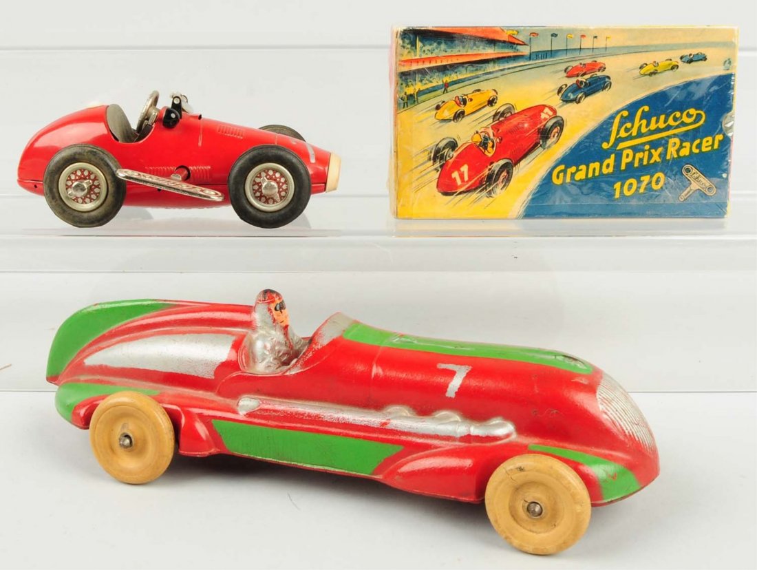 Lot of 2: Vintage Tin Wind-up & Rubber Race Cars.: One is Schuco Grand Prix racer which includes original box. Second is a scarce hard rubber Aburn race car marked No.7. Both have little wear. Condition (Excellent). Size Largest: 10 - 1/2" L.