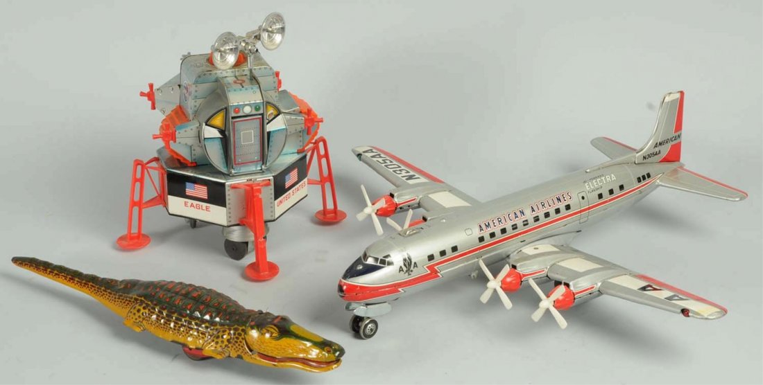 Lot of 3: Vintage Toys.: First is a battery operated United States space capsule. Second is a Japanese American Airlines Electra Flagship airplane all original with props. Last is a tin wind-up alligator. Condition (Very Good