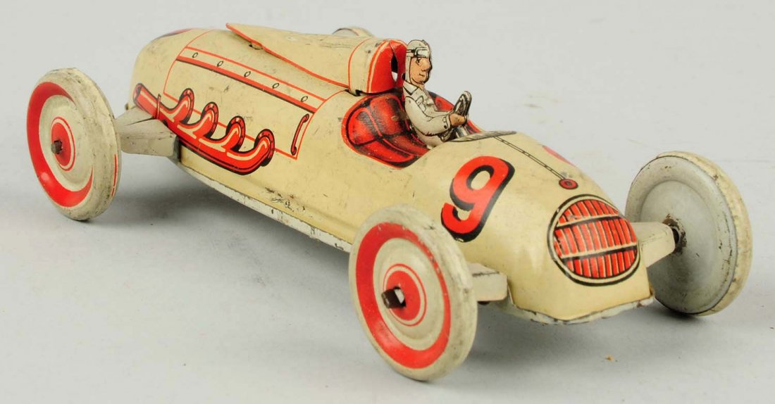 German Tin Litho Wind-up Race Car Toy.: Marked Germany on right front side. Nice separate tin litho race car driver holding steering wheel. Marked No.9 on front and rear. Some minor scratching and wear. Condition (Very Good - Excellent). Si
