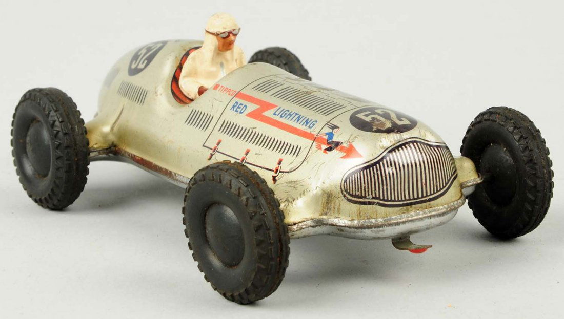 Tipco Tin Wind-up Red Lightning No.52 Racecar.: Car is all original including composition driver. Does have some scratching and wear throughout. Condition (Very Good). Size 6 - 1/4" L.