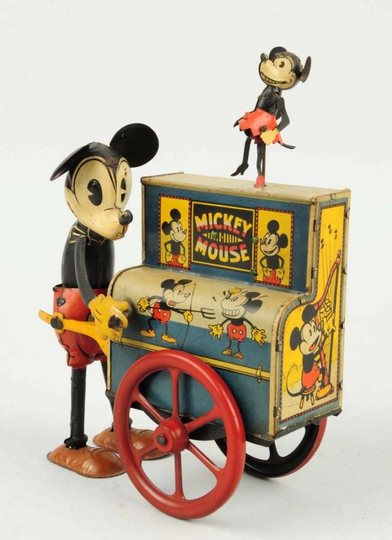 Distler Walt Disney Mickey Mouse Hurdy Gurdy Toy.: German. Wind-up. One of the most desirable early tin litho Mickey Mouse toys. Is all original including Mickeys arms, ears and Minnie who dances on top of roof when toy is in operation. Beautiful colo
