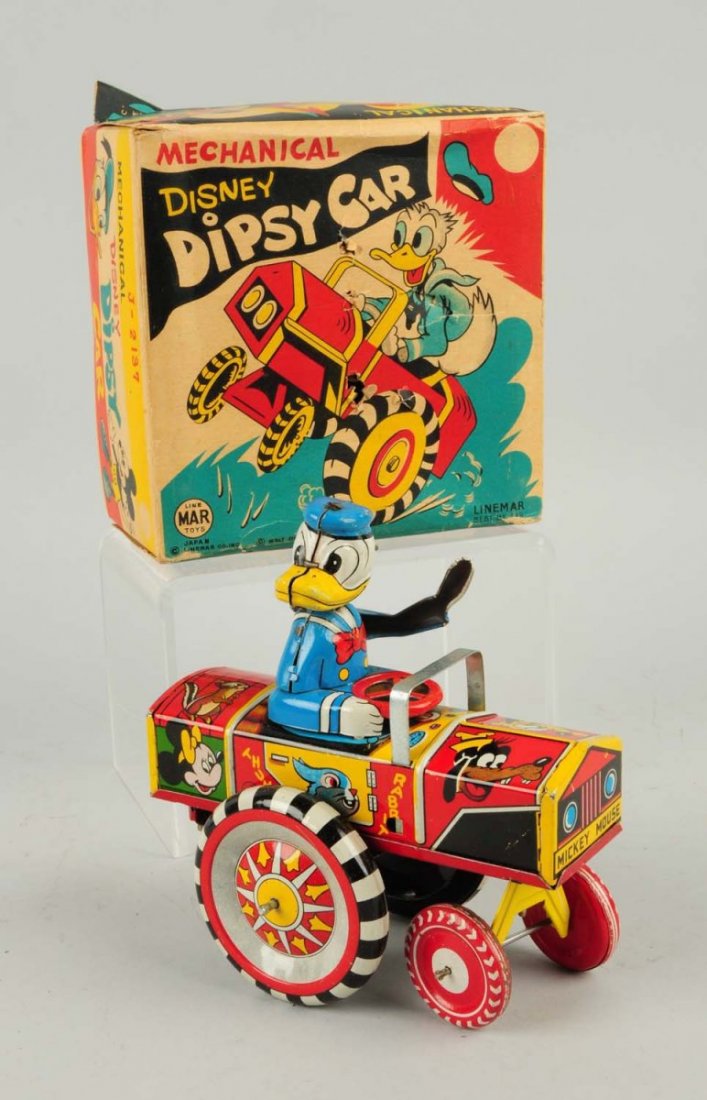 Linemar Tin Litho Wind-up Walt Disney Dipsy Car.: Donald Duck version in original colorful box. Box does have some creasing and one or two poke holes. Car itself has tin bobbing head, lithographed Disney characters around sides of car. Minor scratchi