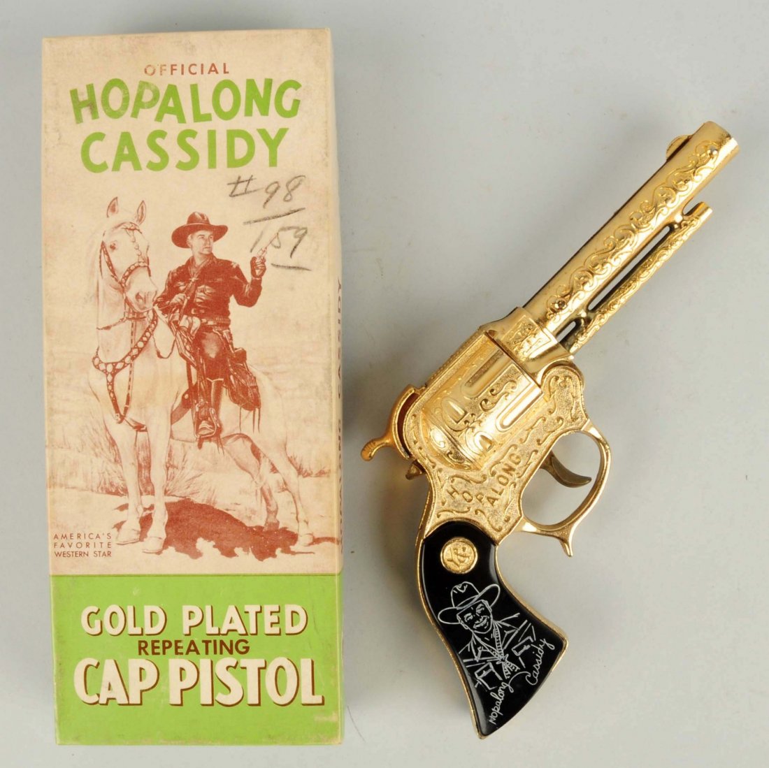 Wyandotte Hopalong Cassidy Cap Pistol Gold Plated: Gun has black Hopalong Cassidy grips. Gold plating is very bright and nice. Does come with original box. With great graphics of Hoppy on his horse on the box. Condition (Excellent). Size Box: 9 - 1/2"