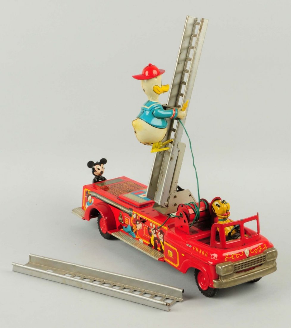 Linemar Walt Disney Donald Duck Fire Truck.: Truck is all original and complete. Includes Pluto fireman as a driver. Has Donald Duck as a fireman climbing up and down a ladder and Mickey Mouse holding on to the rear of the fire truck. Truck is a