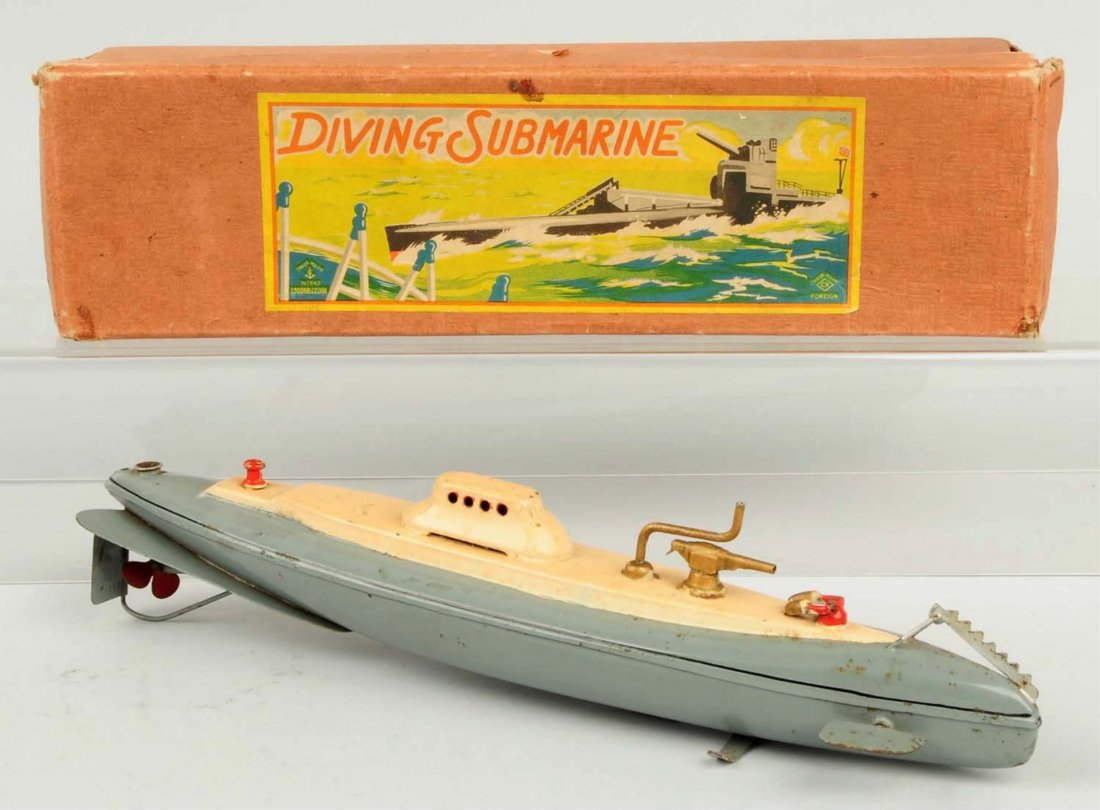 Japanese Pre-war Wind-up Submarine Toy.: Includes original box with very colorful label marked CK Japan. Submarine is in working order. Does have some pitting some general overall wear. Condition (Very Good - Excellent). Size Box: 12 - 3/4"