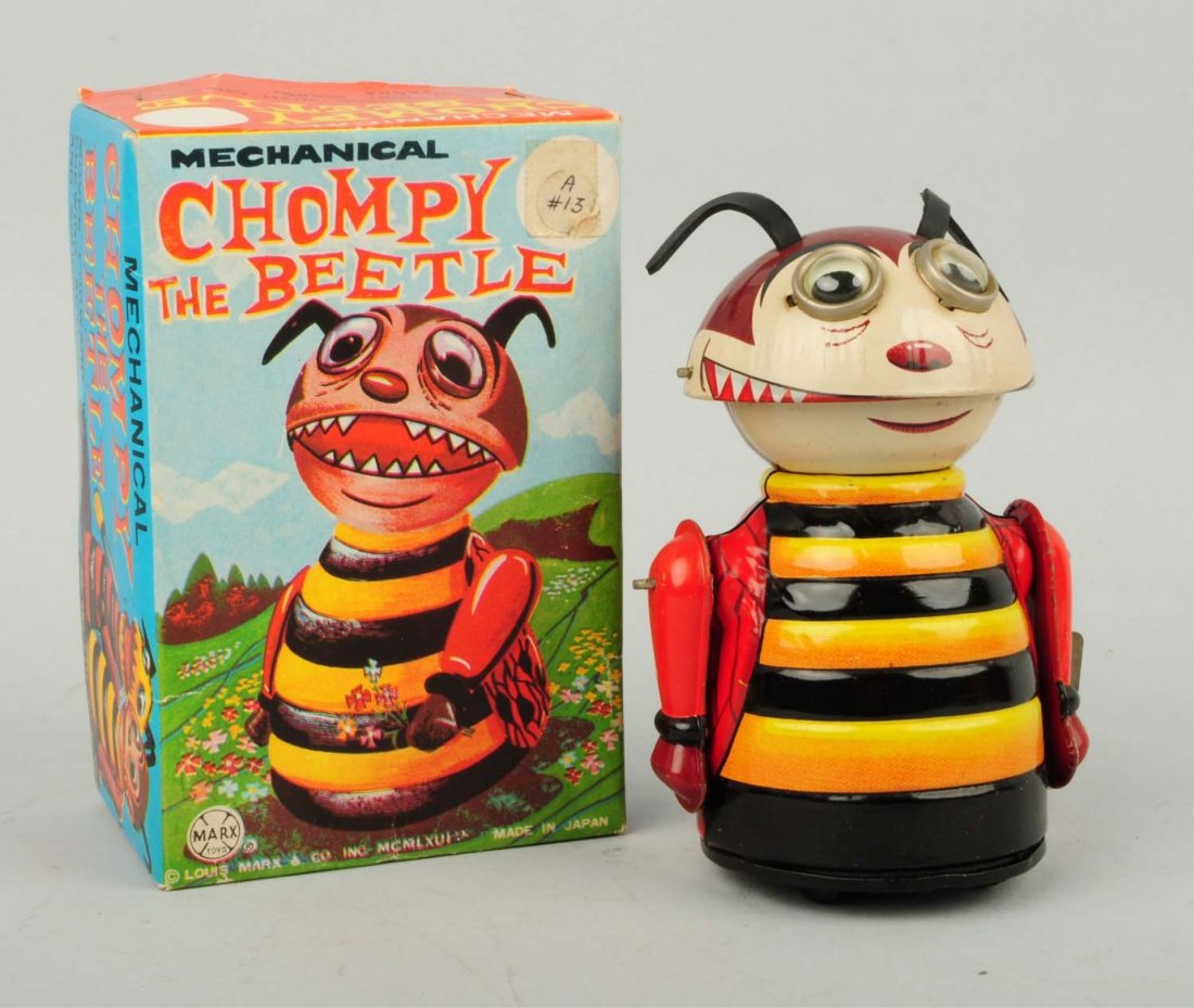 Japanese Tin Litho Windup Chompy the Beetle.: Very colorful variation with a lot of reds, yellows, and oranges. Box is also very colorful. Marked Louis Marx and Company and Roman numerals reading 1965. Made in Japan. Original ears. When in operat