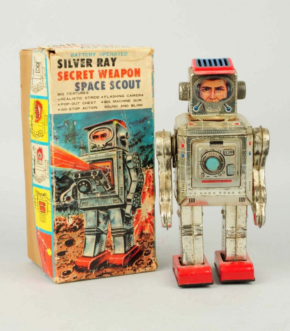 Japanese Battery Operated Space Scout Robot.: Includes original box. Box has heavy creasing to lid. Marked "Silver Ray Secret Weapon Space Scout." Includes cardboard arm holder inserts. Some general wear and oxidation to bare metal parts. Fairly 