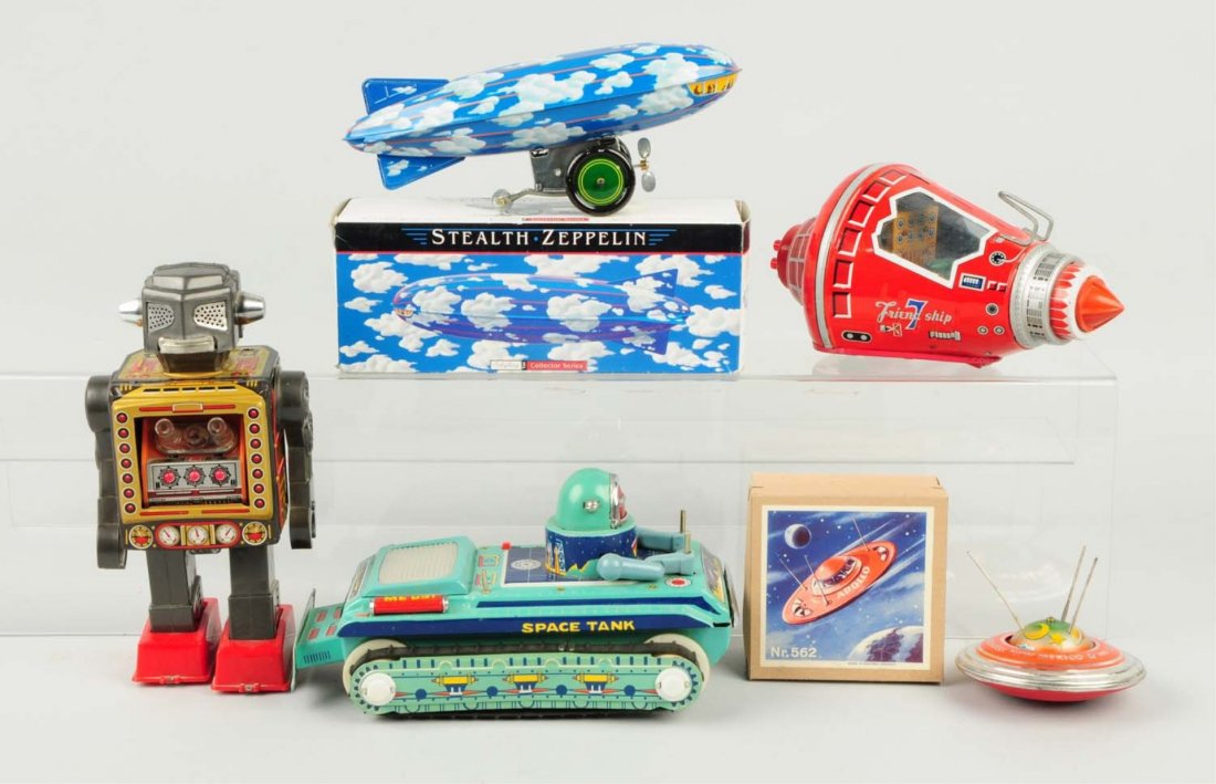 Lot of 5: Contemporary & Vintage Space Toys.: Includes a Friendship seven space capsule, a fighting robot, an Apollo spaceship made in Germany, a Chinese space tank and a Shilling Stealth Zepplin. Some with original boxes. Condition (Very Good). 