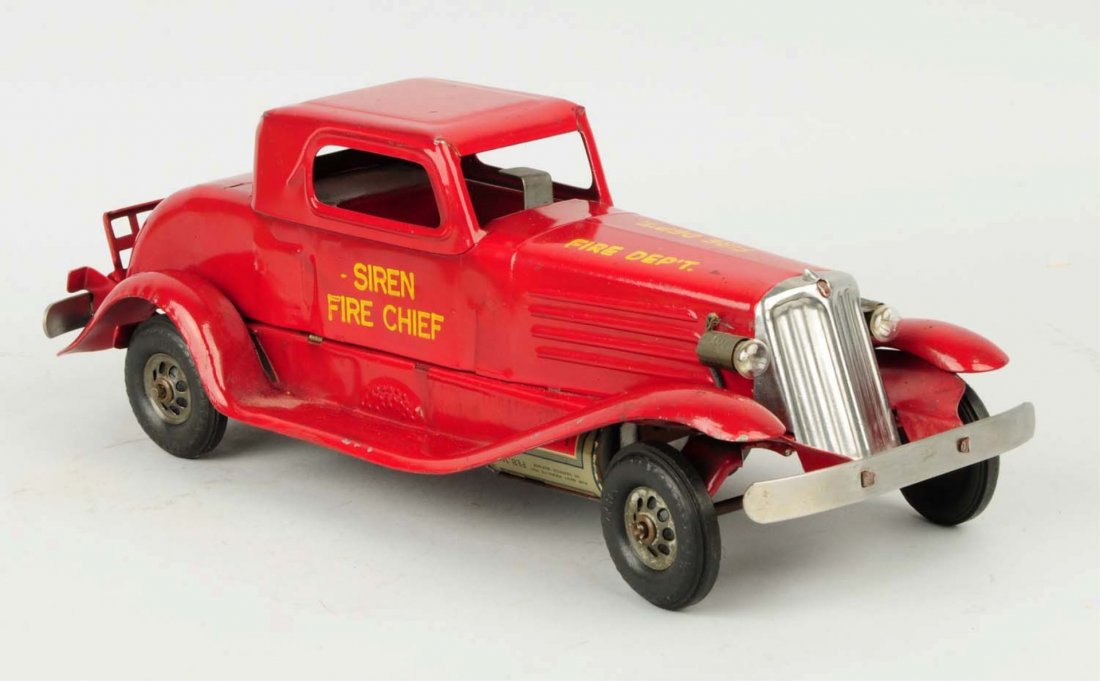 Pressed Steel Marx Wind-up Fire Chief Car.: Marked Siren Fire Chief on both sides. Electric bulbs in front and rear tail light. Has original batteries dated 1939. Very little wear. Just minor scratching and nicking. Condition (Excellent - Near 