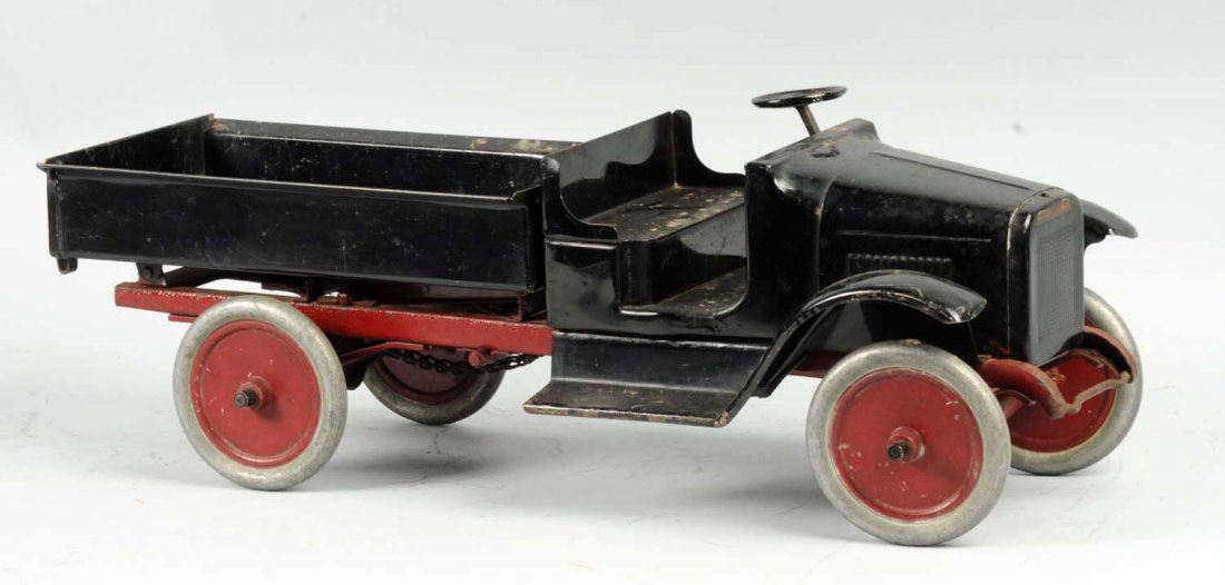 Pressed Steel Buddy L Chain Dump Truck.: Appears to be all original. Does have significant paint loss and corrosion throughout. Condition (Good - Very Good). Size 24" L.
