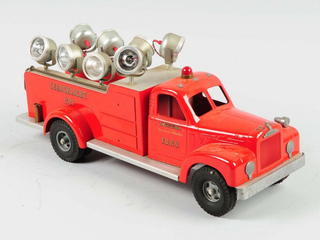 Contemporary Smith-Miller FDNY Search Light Truck: Truck is all original and complete. Does have a couple of minor chips to the paint. Has working search lights. Condition (Excellent). Size 19" L.