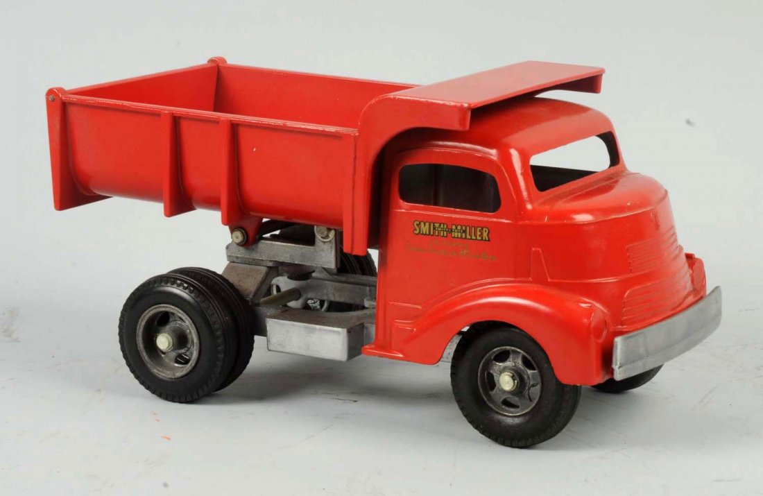 Smith-Miller Pressed Steel Dump Truck.: Truck has been professionally restored. Does have a couple of minor chips and edge wear. Condition (Excellent). Size 11" L.