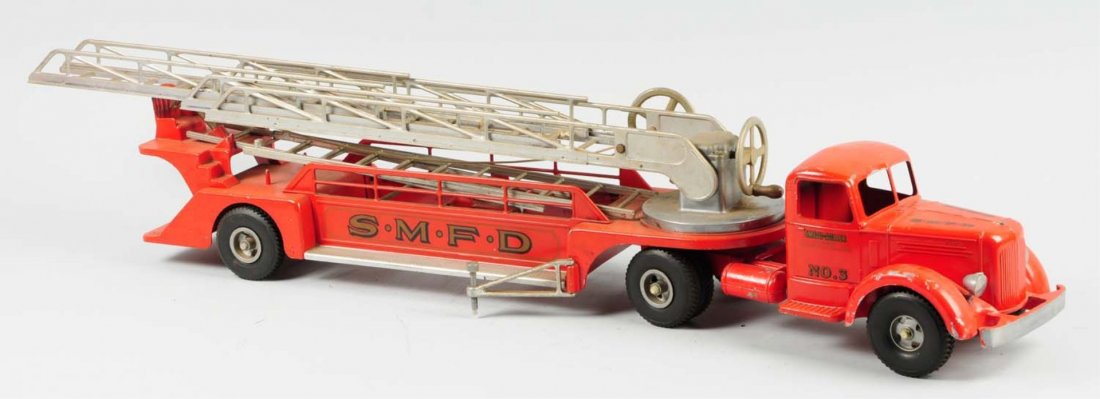 Smith-Miller Pressed Steel Ariel Ladder Truck.: Truck has a Mack front end. All original condition with original ladders. Does have some chipping and wear throughout. Condition (Very Good). Size 40" L.