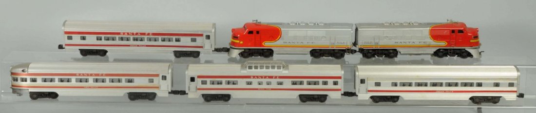 Lionel O27 Gauge Santa Fe Passenger Set.: Post war. Includes No.2243 power unit which has some paint chipping and wear to nose cone. Decal is pretty good. Wear on bottom of the rear. Some slight corrosion in battery box. Also includes No.2383