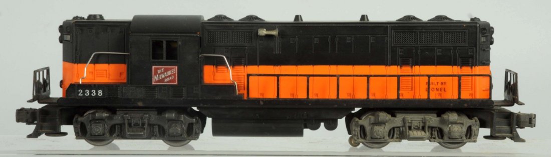 Lionel O Gauge No.2338 Milwaukee Road Engine.: Post war. GP-7 style. More common black cab version. Some general overall wear. Slight oxidation to bottom frame. Condition (Very Good).