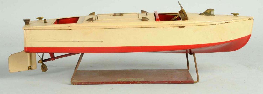 Lionel Tin Clockwork Toy Motorboat.: Pre-war. Marked Lionel-Craft on back of boat and on original stand. Also marked the Lionel Corporation. Boat looks to be complete except for one missing stansion on back right of boat and also missing