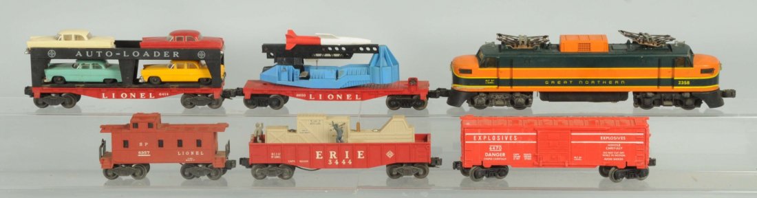 Lionel Great Northern Freight Train Set.: Super O. Post war. Includes No.2358 Great Northern Rectifier engine. EP-5 styling. Battery box seems clean but oxidation to battery cover. Decals have been replaced. Some wear underneath where the dec