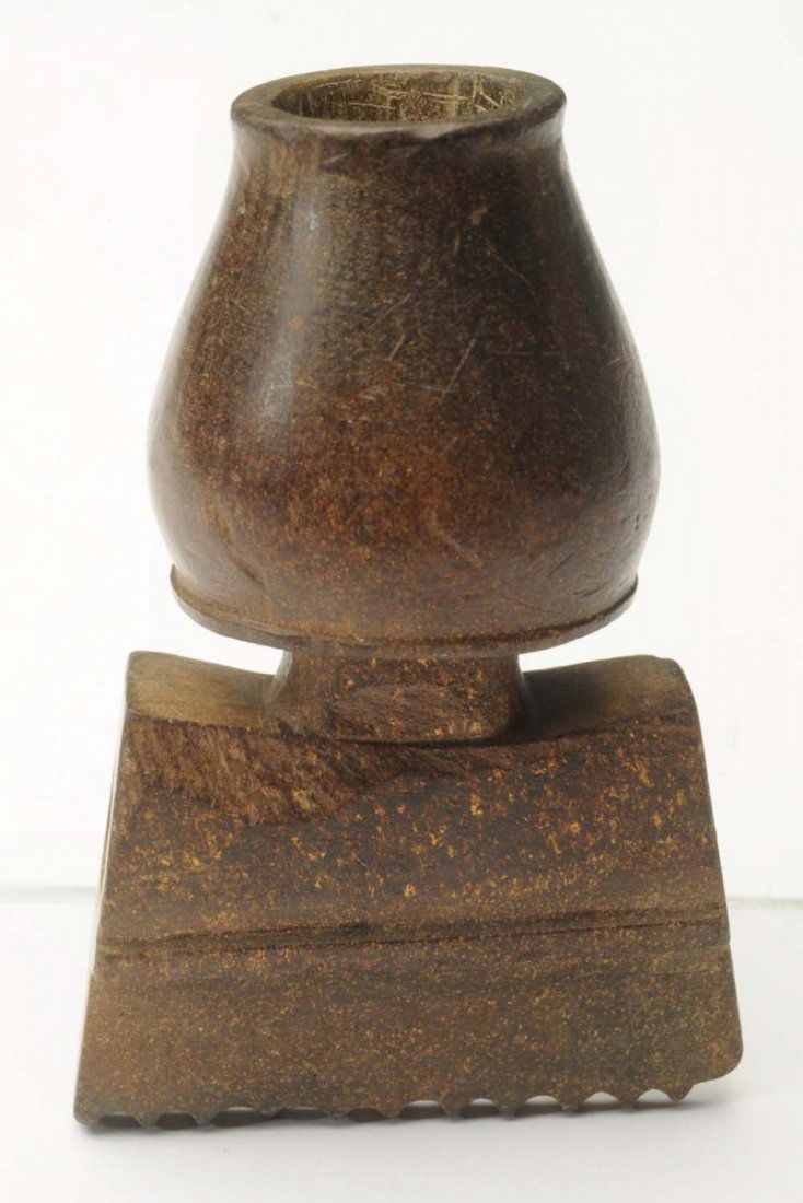 Golden Steatite Mic-Mac Pipe.: Historic 300 - 200 B.P. Likely origin Wisconsin. Made of an unusual brown Steatite which contains a â€œgold dustâ€ like mineral within the matrix that glitters in light. The keeled, scalloped h