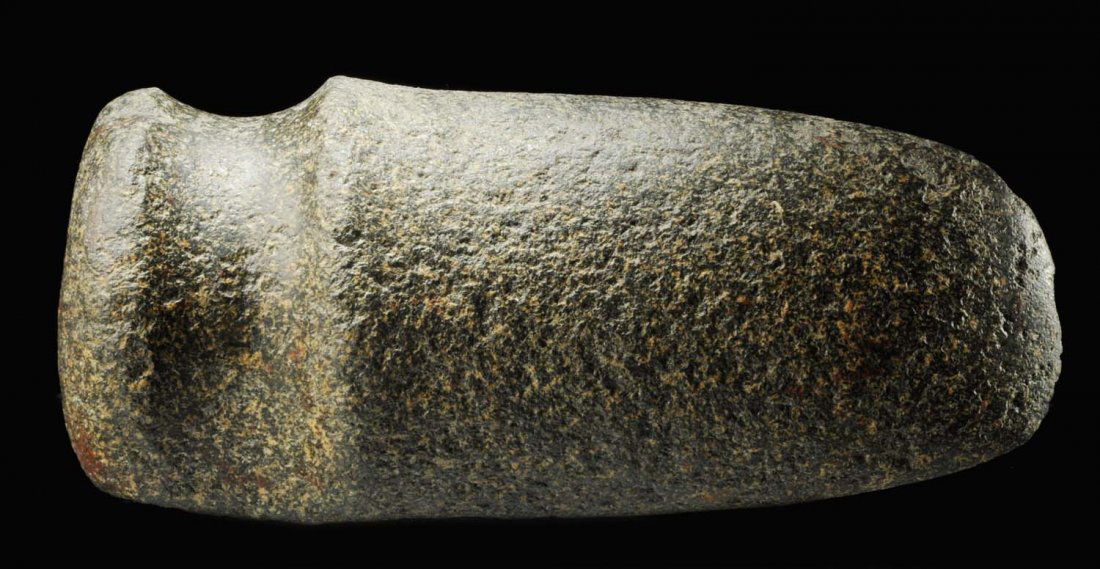 Round Base, Three Quarter Groove Axe.: Archaic 7000 - 5000 B.P. Likely origin Indiana. Made of a dark green wiry granite. This axe is a well-made example of the rare Indiana round base style. Several chips on the bit. Size L. 8" x W. 3 - 1