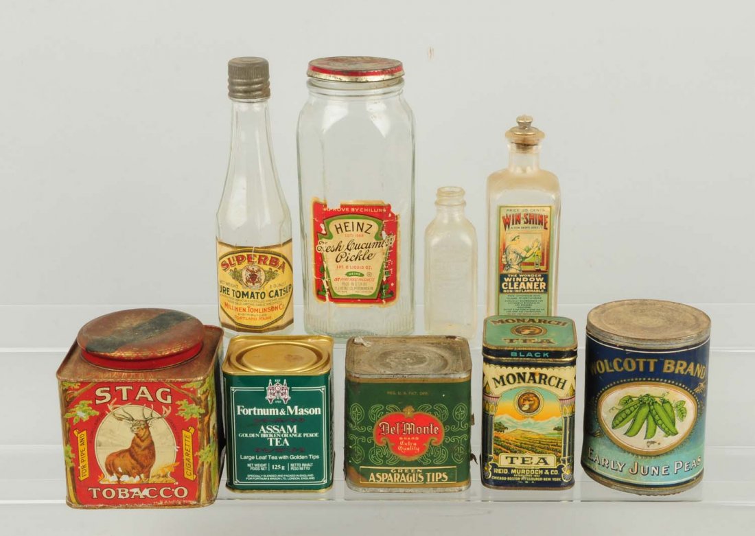 Lot of Advertising Tins & Bottles.: This lot includes several tea tins, food bottles, and other items. Condition (Very Good). Size Largest: 8" L.