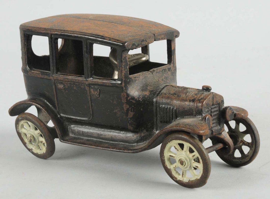 Cast Iron Arcade 3 Window Sedan.: Has original nickel driver. Medium to heavy paint loss throughout especially to the roof. Condition (Good). Size 6 - 1/4" L.