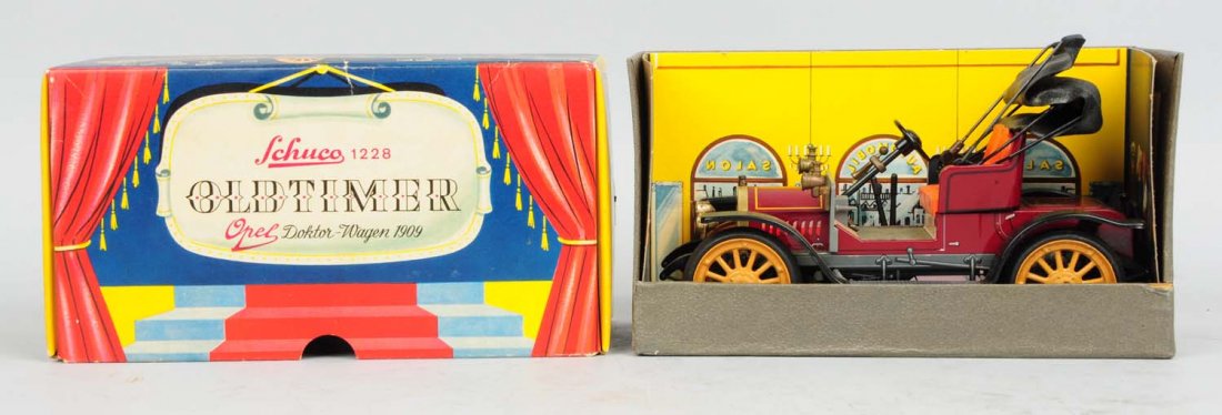 German Schuco 1228 Oldtimer 1909 Doctor-Wagon.: With original box. Box has beautiful picture of the car, the doctor, and his dog on one panel and a picture with the car at an old gas station. The insert of box has color pictures of eight people and