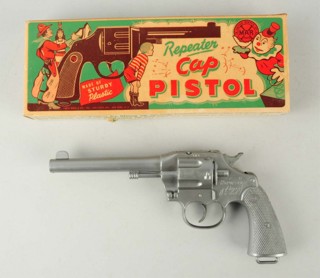Marx Repeater Toy Cap Pistol.: Includes original box. Is scarce silver color. Unused old store stock. Condition (Near Mint). Size 10 - 1/2" L.