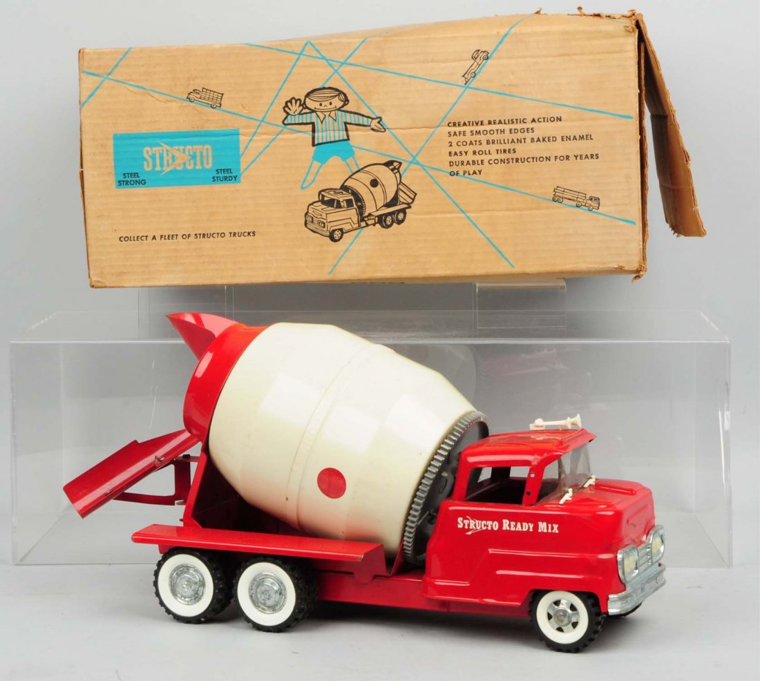 Pressed Steel Structo No. 609 Steel Sturdy.: Ready mix concrete truck with original box. Box has pictures of the truck and a child in blue and black colors on three of the panels and two of the flaps. Box has two tears on one of the panels and s