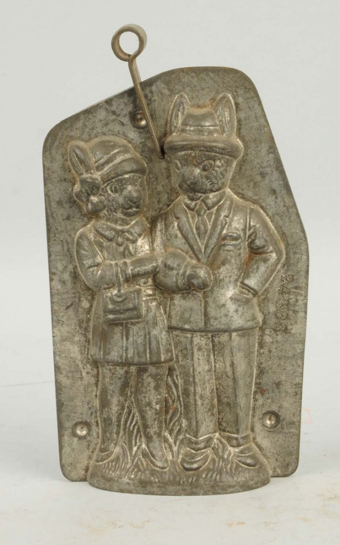 Standing Rabbit Couple Chocolate Candy Mold.: This mold depicts two rabbits dressed as a man and a woman. Moderate wear and oxidation to surface. Still a great, rare mold. Condition (Very Good). Size 7" T.