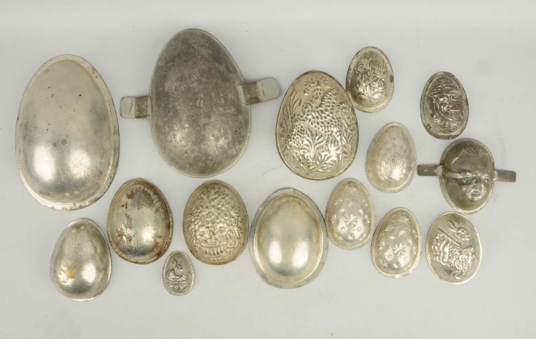 Large Lot of Half Egg Chocolate Molds.: This lot includes some of the egg molds are decorated but many are plain. Condition (Very Good). Size Largest: 9 - 1/2" T.