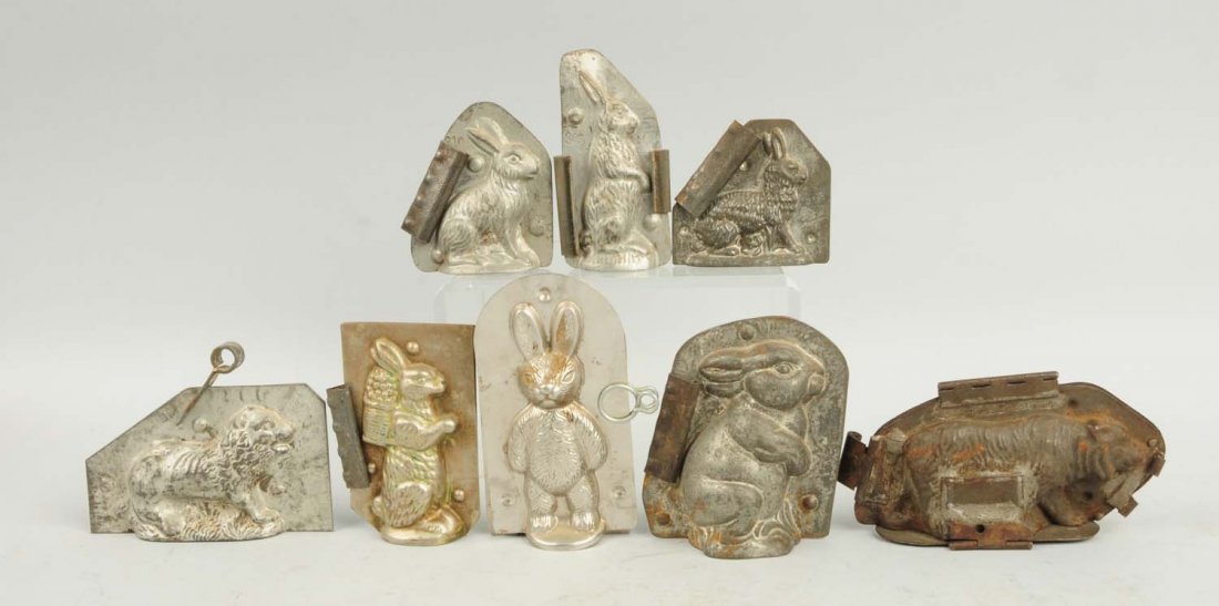 Lot of 8: Small Chocolate Molds.: This lot includes an early walking bear mold, a lion mold and six assorted small rabbit molds. Condition (Very Good). Size Largest: 5 - 1/4" T.