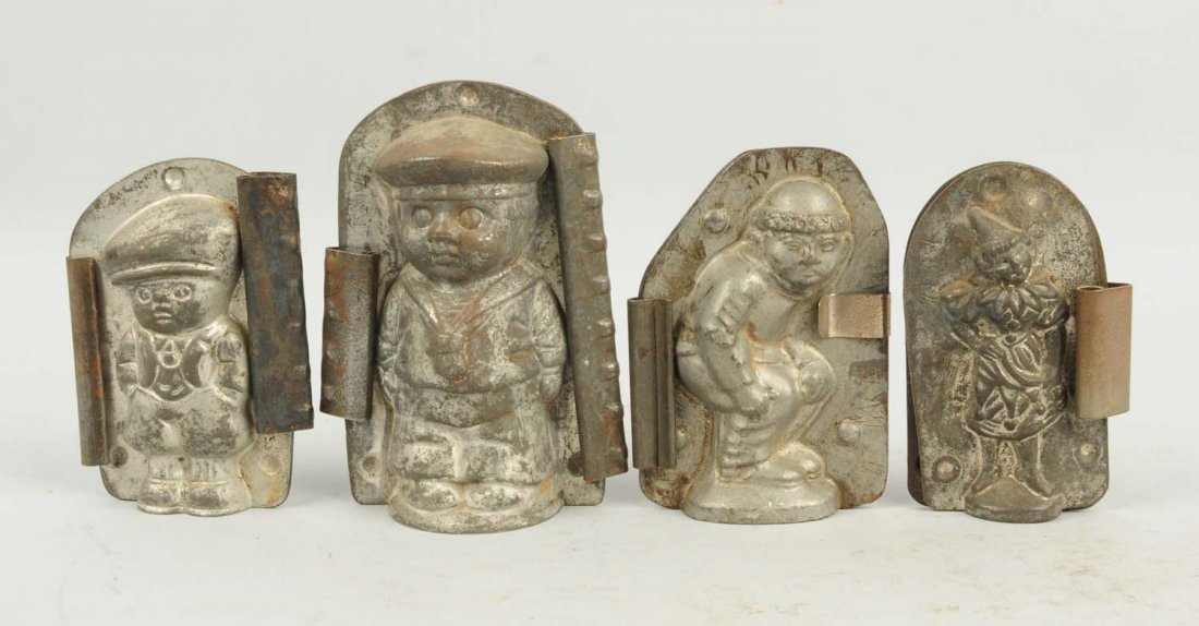 Lot of 4: Small Chocolate Molds.: This lot includes a girl clown, and three small boys. Condition (Very Good). Size Largest: 5" T.