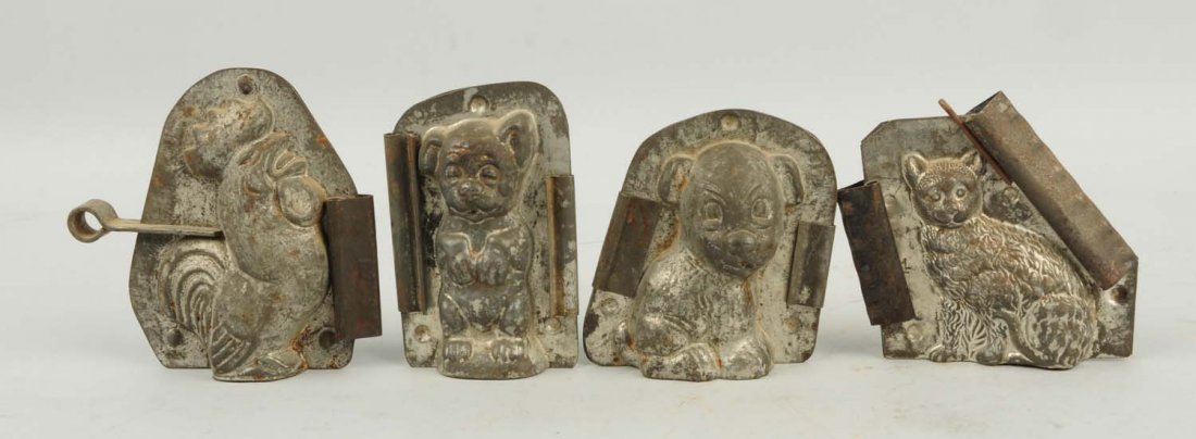 Lot of 4: Small Animal Chocolate Candy Molds.: Includes two dogs, a cat, and a rooster. Condition (Very Good). Size Largest: 4 - 1/4" T.