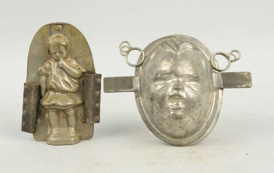 Lot of 2: Children Chocolate Molds.: This lot includes a two faced baby head mold and a small standing girl mold. Condition (Very Good). Size Largest: 4 - 3/4" T.