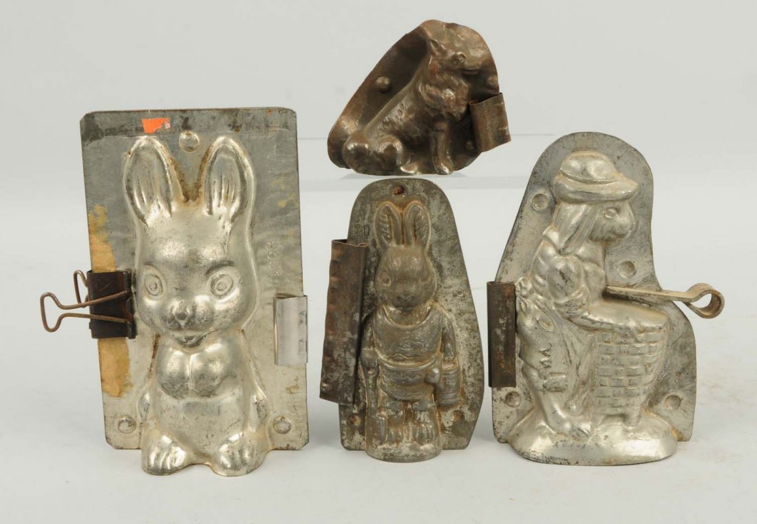 Lot of 4: Chocolate Candy Molds.: Includes three assorted rabbit molds and one small dog mold. Condition (Very Good). Size Largest: 6 - 1/4" T.