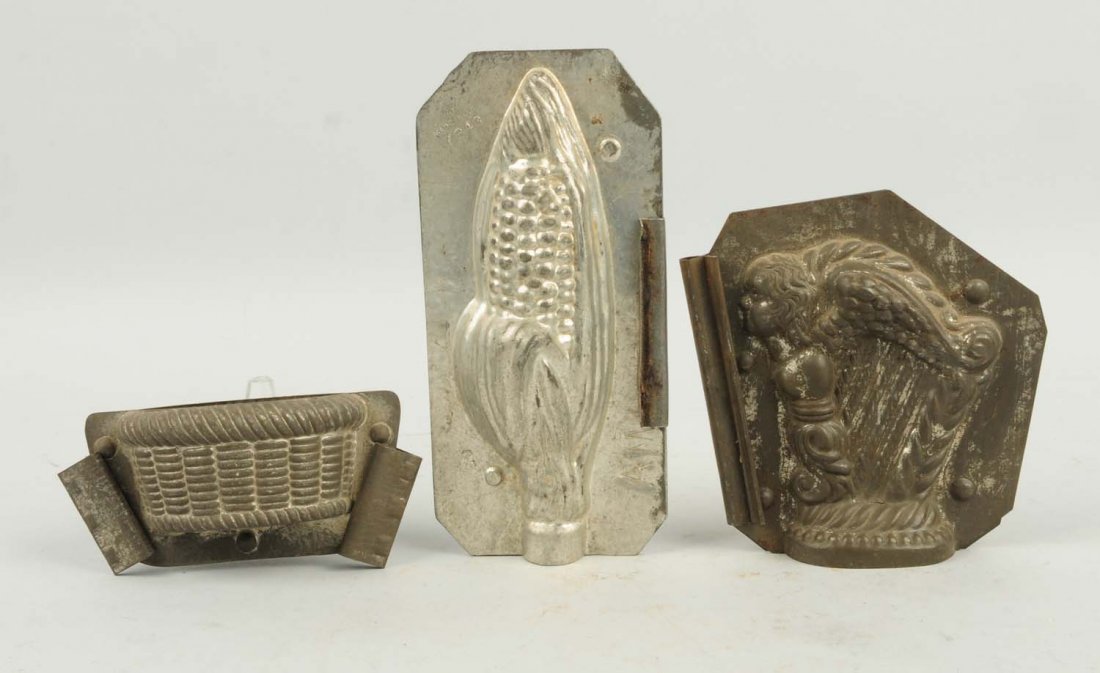 Lot of 3: Small Chocolate Candy Molds.: Includes a harp, a small basket, and an ear of corn. Condition (Very Good). Size Largest: 6 - 1/2" T.