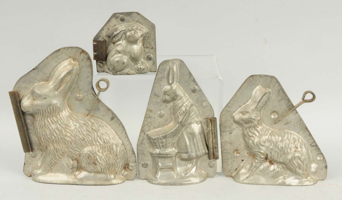 Lot of 4: Small Rabbit Chocolate Molds.: This lot includes on rabbit dressed in clothing and three others. Condition (Very Good). Size Largest: 6 - 1/4" T.