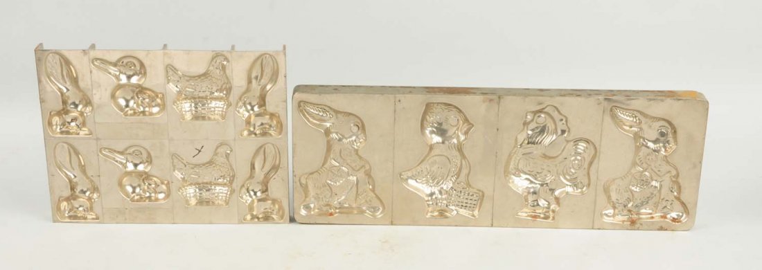 Lot of 2: Modern Chocolate Candy Molds.: Each of these two molds depict a certain animal including rabbits, peeps, chickens, etc. Condition (Excellent). Size Largest: 17" L.