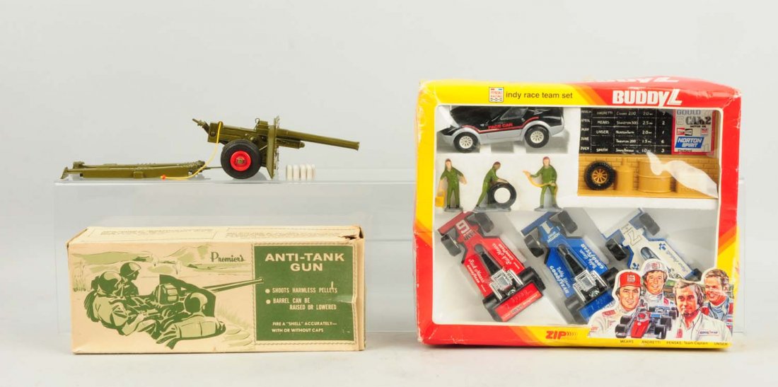Lot of 2: Anti-Tank Gun & Buddy L Playset.: Includes a cast iron Prmier's Anti-tank gun and Buddy L Indy Race team playset. Both are in original boxes. Box for anti-tank gun has a couple small tears to four side panels and some creasing to two 