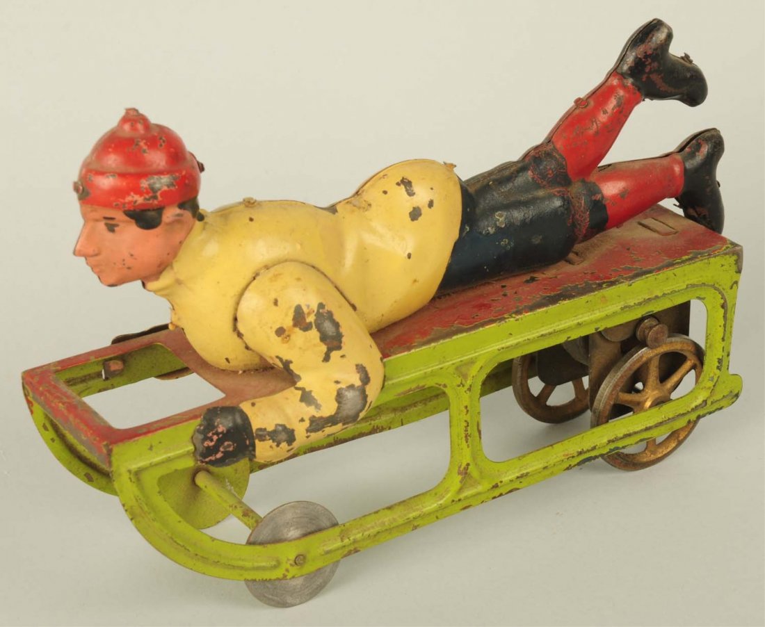 American Made Hill Climber Mechanism Sled Toy.: Circa 1920. Original paint. Paint does have some chipping and wear. Condition (Very Good). Size 9" L.