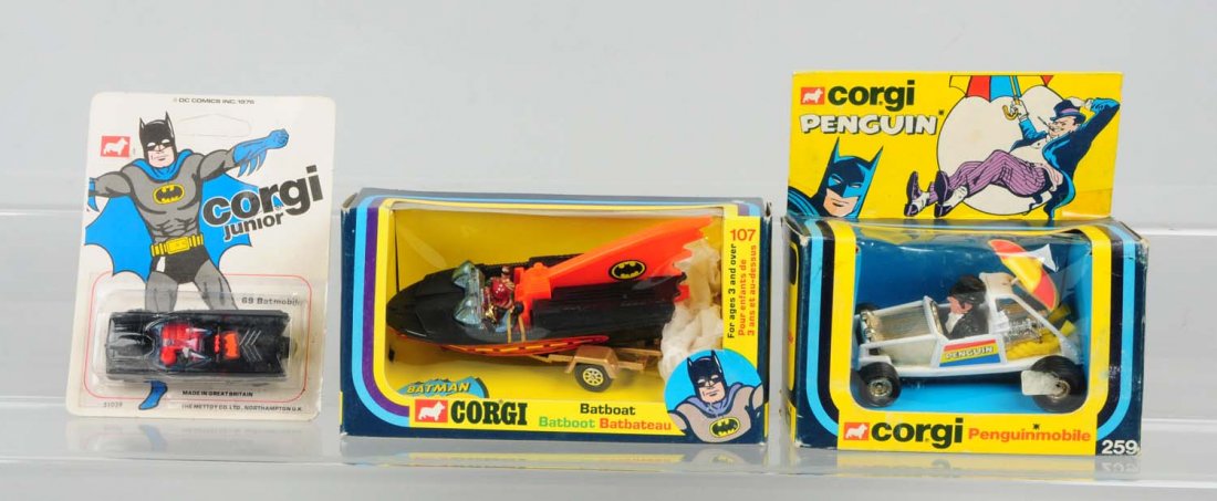 Lot Of 3 Corgi Batman Toys In Boxes.: Includes penguin Mobile, Bat Boat, 69 Batmobile. Two of boxes have slight creases throughout. All boxes have colorful pictures of Batman in action. Two boxes have nice inserts. All toys have great det